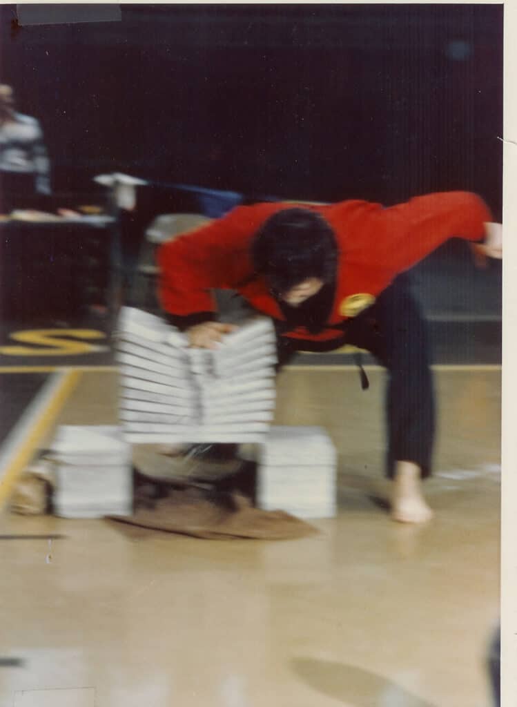 Mr. Oster breaking bricks in 1977