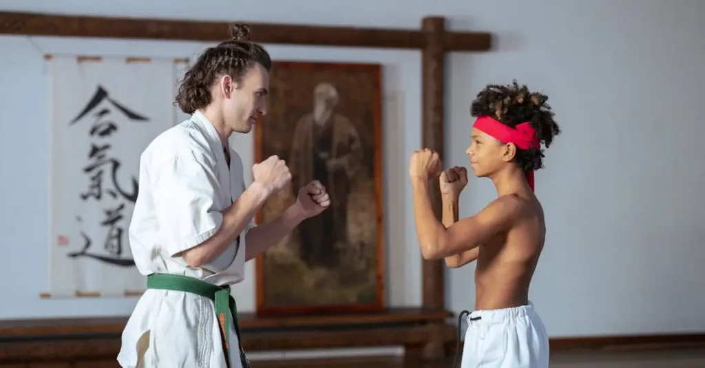 Instructor and student practicing simple self defense techniques with focus and proper stance.